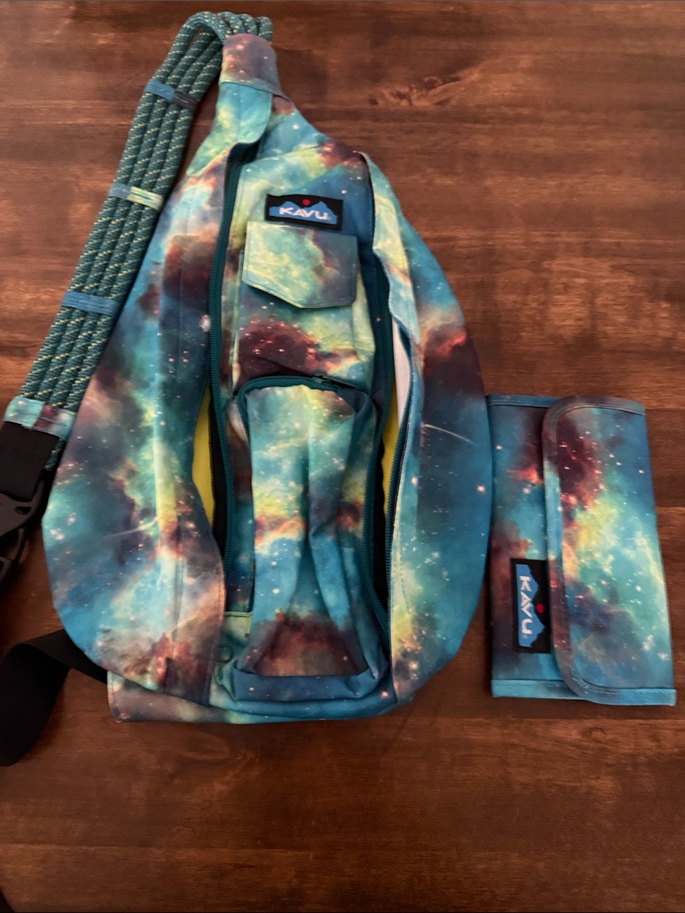 Kavu Galaxy Print Rope Sling Bag in Teal and Navy with matching wallet